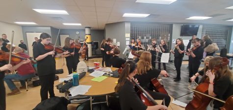 The middle school orchestra performs.