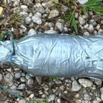 Police tape and a bomb squad response near a roadside investigation in Paw Paw, Michigan
